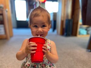 Young girl enjoying a chocolaty drink at Cedar Rapids Lodge