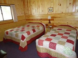 Cedar Rapids Lodge Cabin 1 double bed bedroom