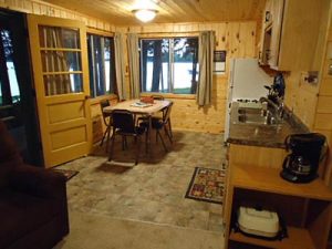 Cedar Rapids Lodge Cabin 3 kitchen and dining area