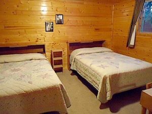 Cedar Rapids Lodge Cabin 3 double bed bedroom