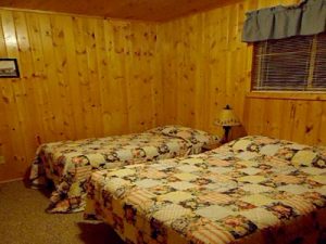 Cedar Rapids Lodge Cabin 6 double bed bedroom